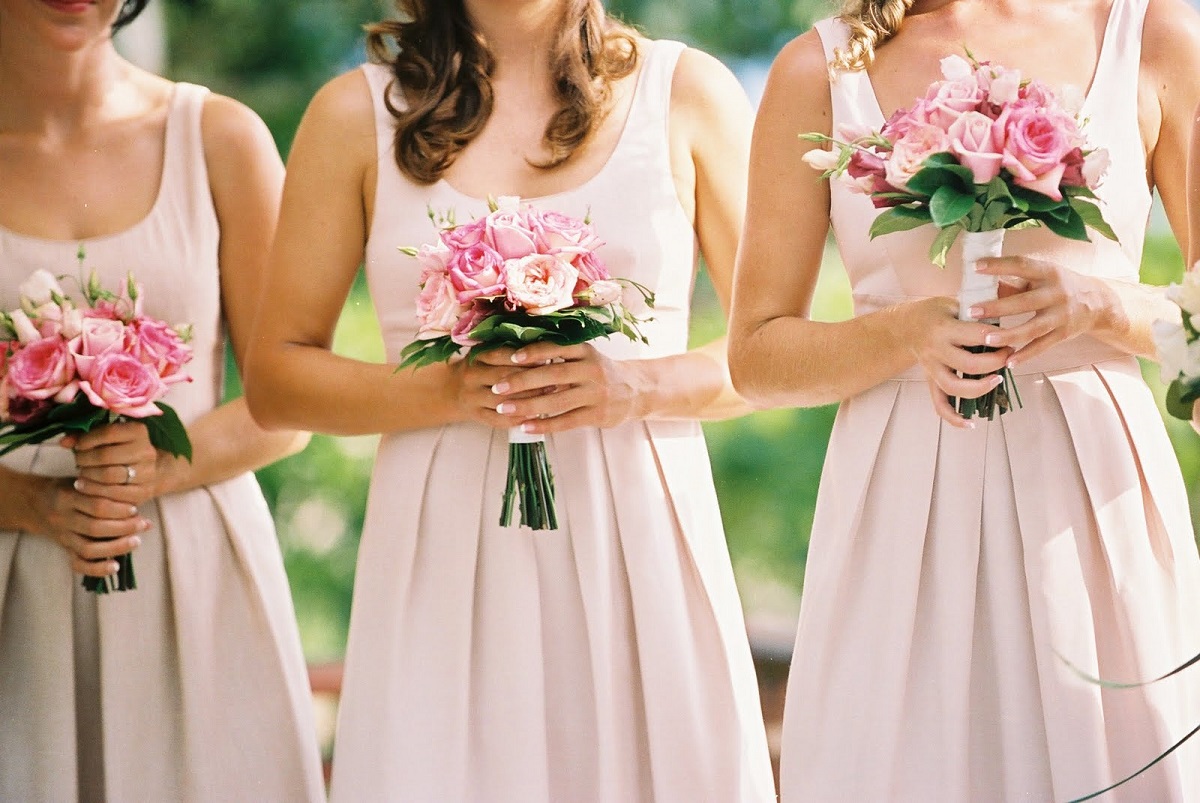 Bridesmaids wearing matching dresses
